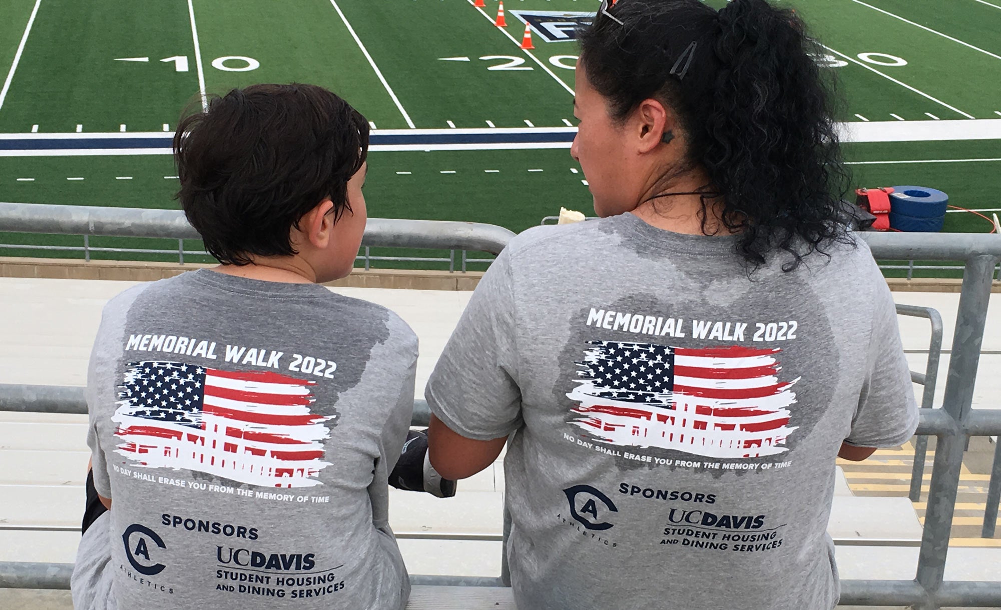 Boy and mom in ?9/11 Memorial Stair Climb" T-shirts after completing 110 flights of stairs