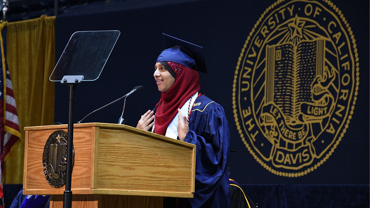 A student speaks on the graduation stage