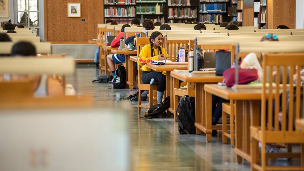 students study in peter j shields library