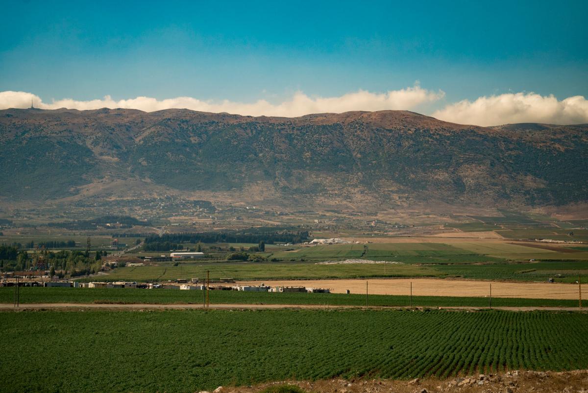 A refugee camp sits among agriculture fields in the Bekaa Valley, Lebanon