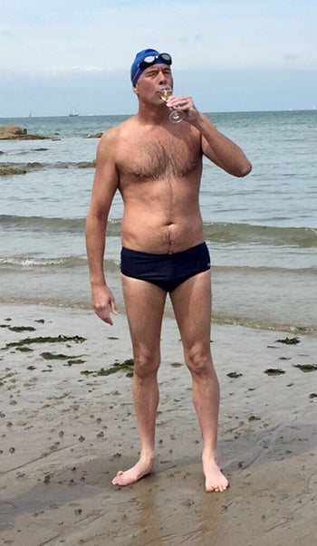 Ernie Hoftyzer drinking champagne after swimming the English Channel.