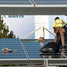 Workers install solar panels at UC Davis.