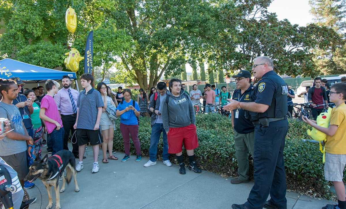 Police Chief Matt Carmichael addresses a crowd before the department's Pokemon GO walk.