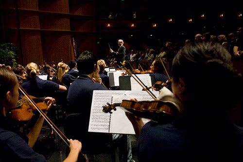 An orchestra performs in the Mondavi Center.