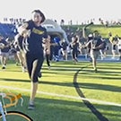 First-year students run onto the field.