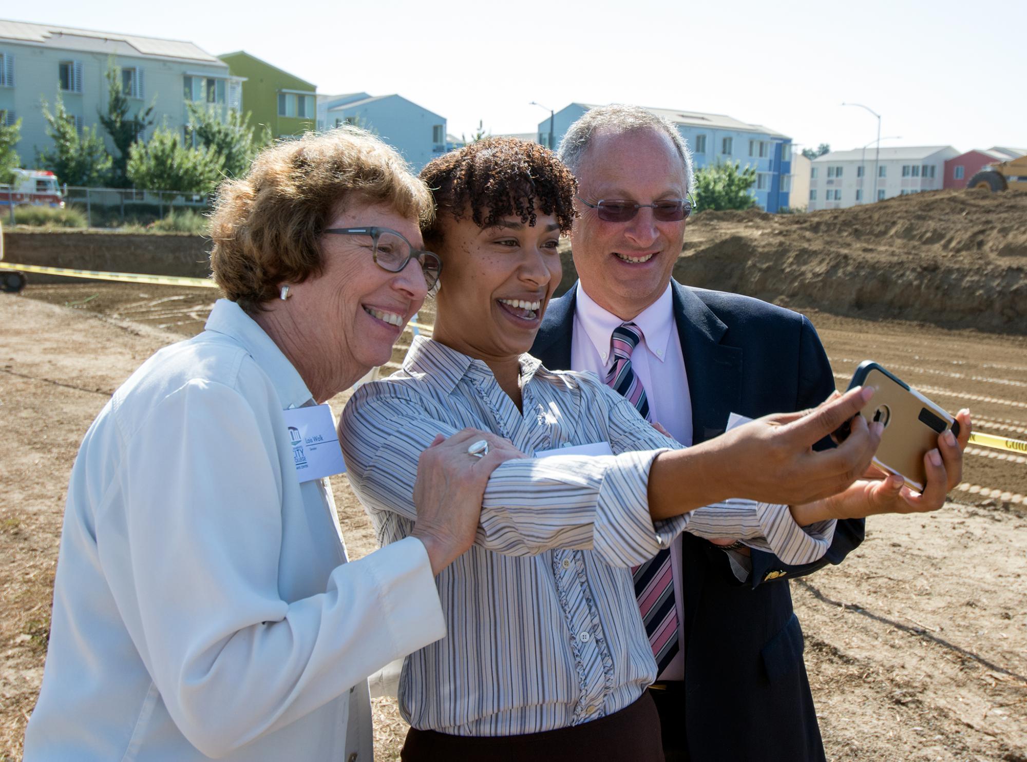 State Sen. Lois Wolk, Los Rios Community College Student Trustee Marianna Sousa and UC Davis Acting Chancellor Ralph J. Hexter pose for a photo.