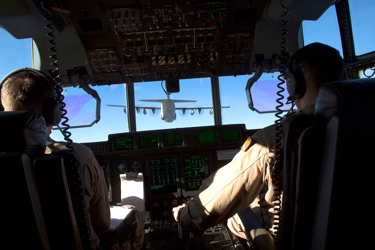 Sean Elliott co-piloting a C-130.