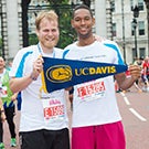 Runners holding UC Davis banner