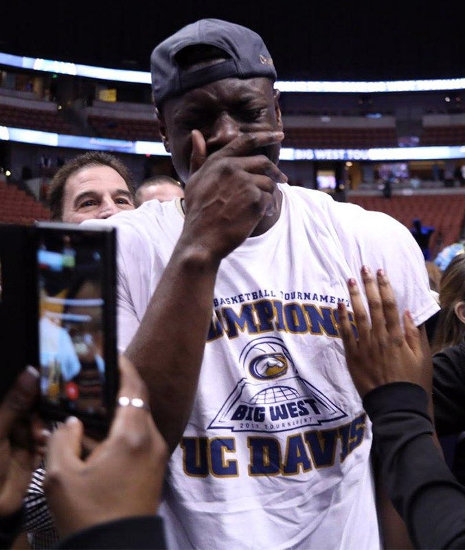 Basketball player overcome with emotion.