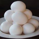 Eggs piled on a plate.