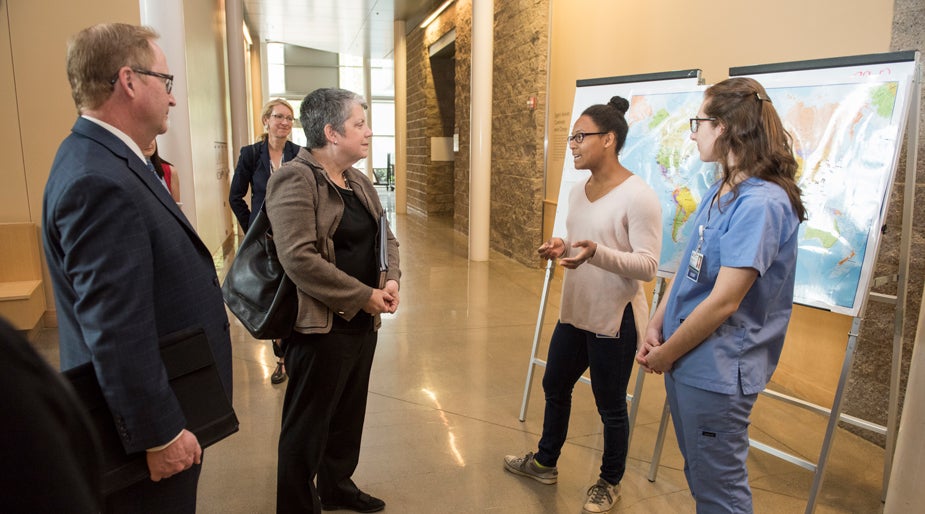 Dean Michael Lairmore and UC President Janet Napolitano listened to a presentation by students 