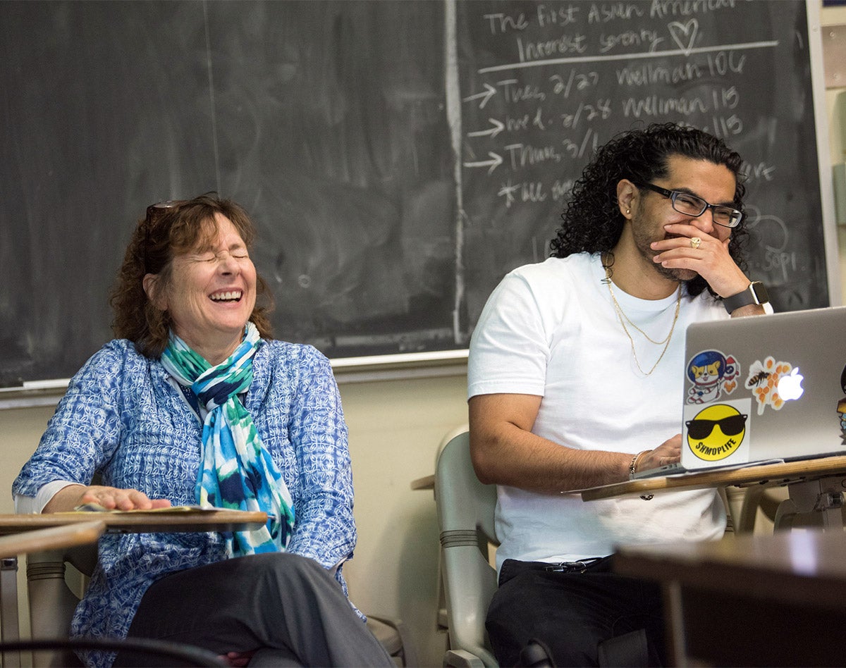 Judy Callis laughing with a student.