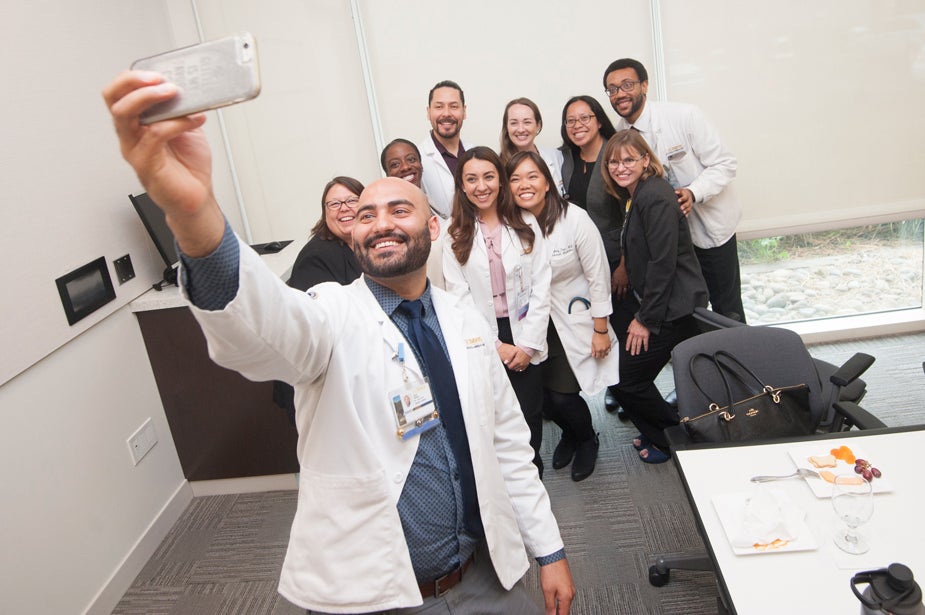 Medical students pose for a selfie.