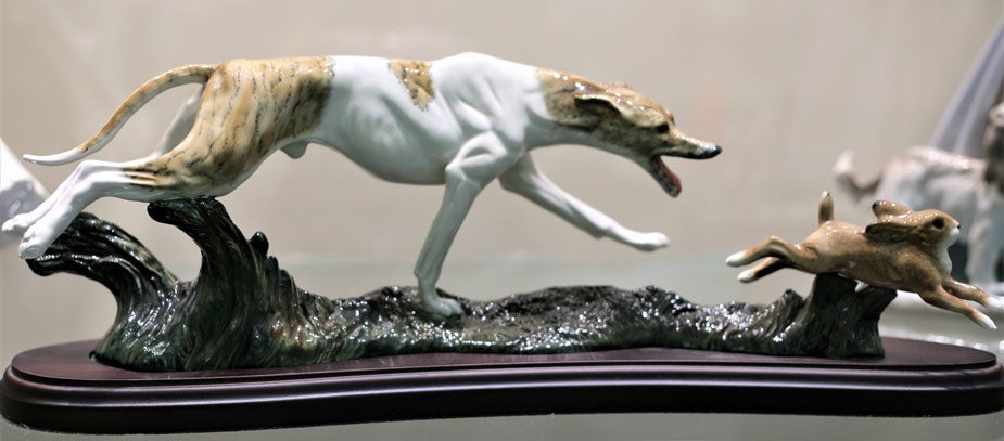 "Greyhound Chasing rabbit," ceramic sculpture