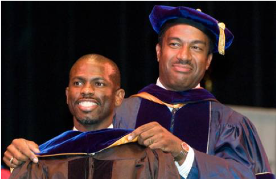 Gary May, as dean of engineering at Georgia Tech, confers Ph.D. on one of his students, Cleon Davis, in 2015.