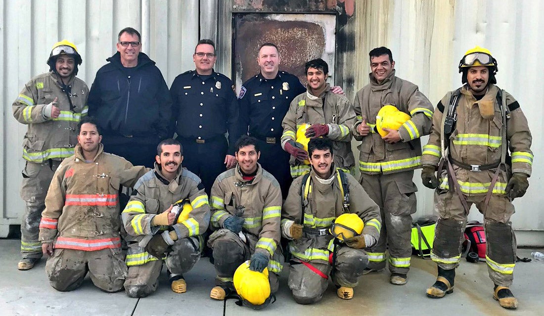 Saudi firefighters pose for a group photo.