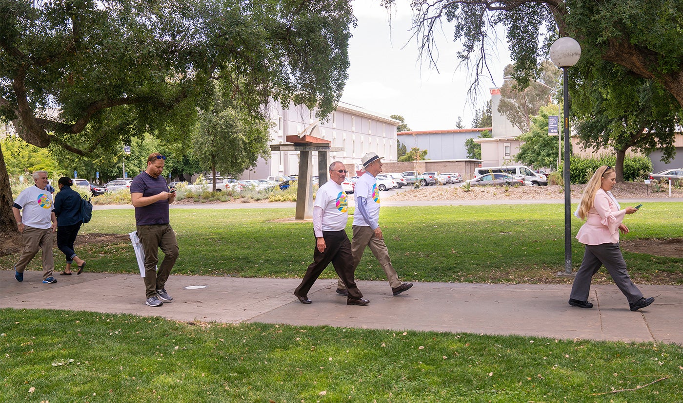 Ralph J. Hexter and Ken Burtis walk during UC Walks.