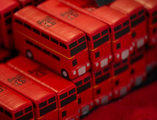 A pile of red double-decker buses, squeezy toys