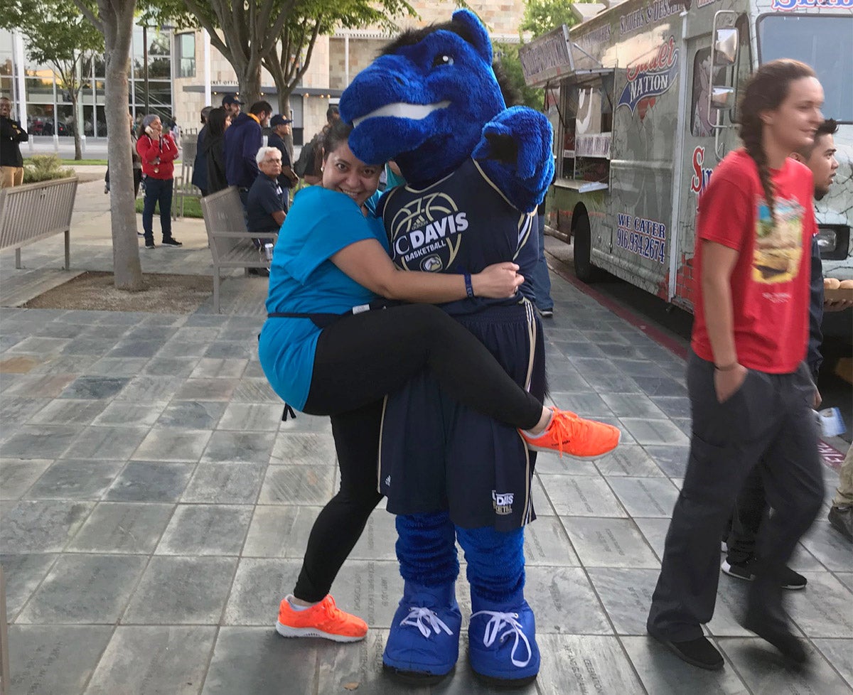 Woman hugs Gunrock at UC Davis
