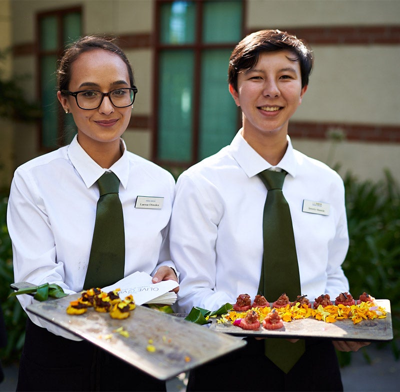 Student servers at an Olive and Vine event.