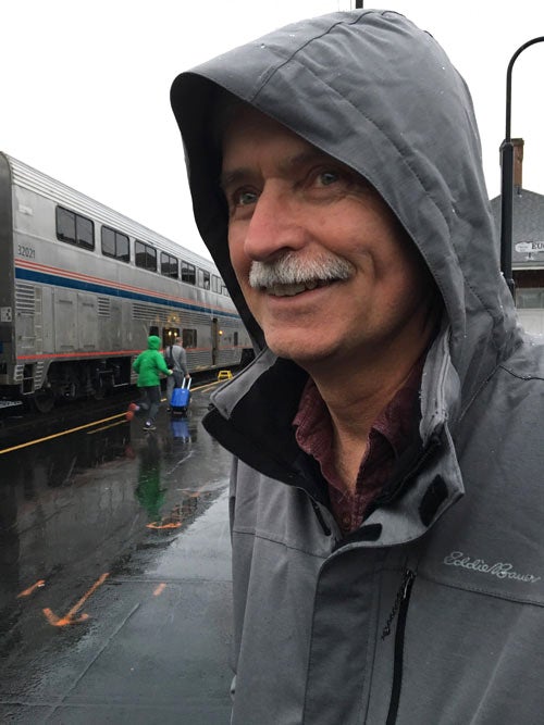 Bill Buchanan, in rain jacket, on train platform