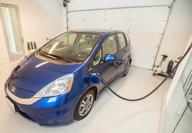 Honda Fit, plugged in, in garage