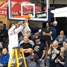 LeShelle May cuts down a basketball net.