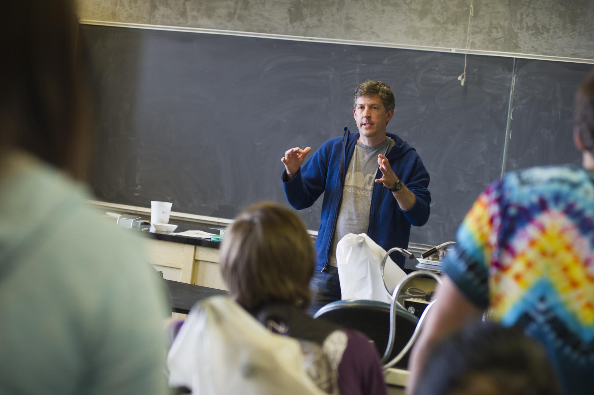 A professor lectures in a classroom