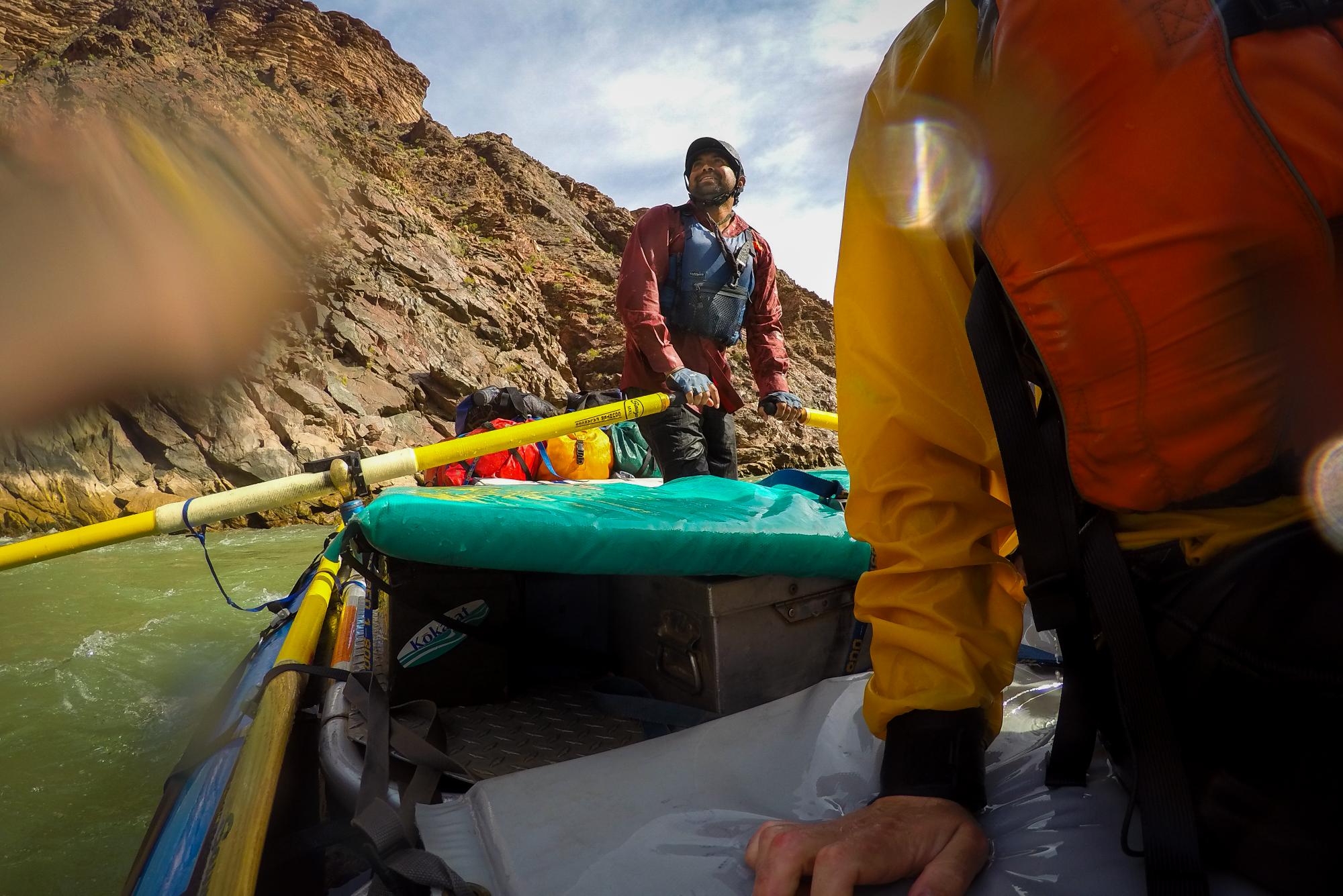 River guide rows raft on Colorado River in Grand Canyon