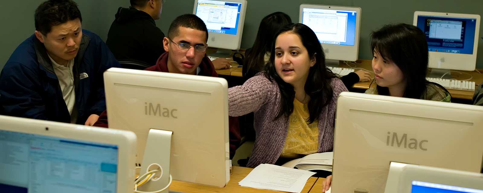Male and female students discussion in computer lab