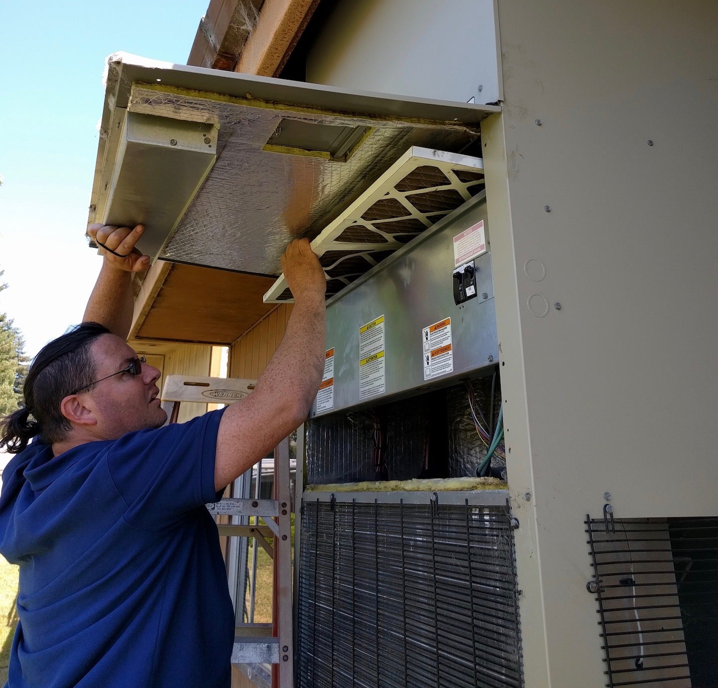 Man checks HVAC system