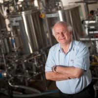 Photo of Charlie Bamforth, Anheuser-Busch Endowed Professor of Malting and Brewing Sciences Emeritus in a brewing classroom.