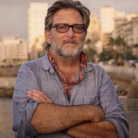 Keith Watenpaugh standing with his arms crossed in Beirut
