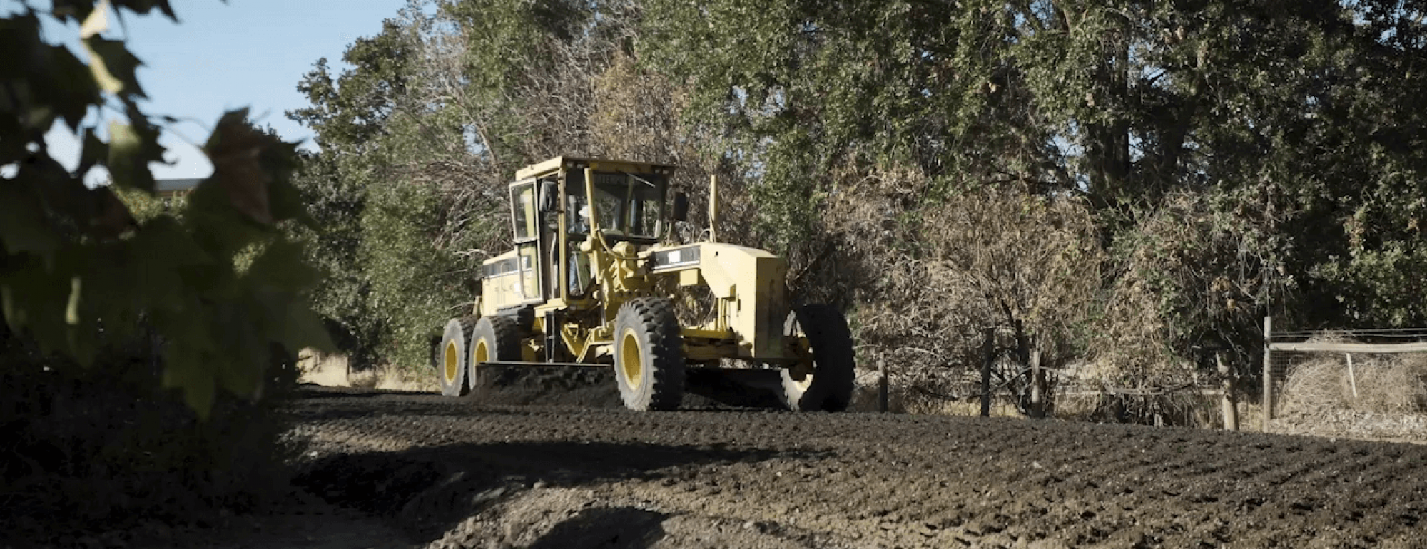 researchers prepare to pave dirt road
