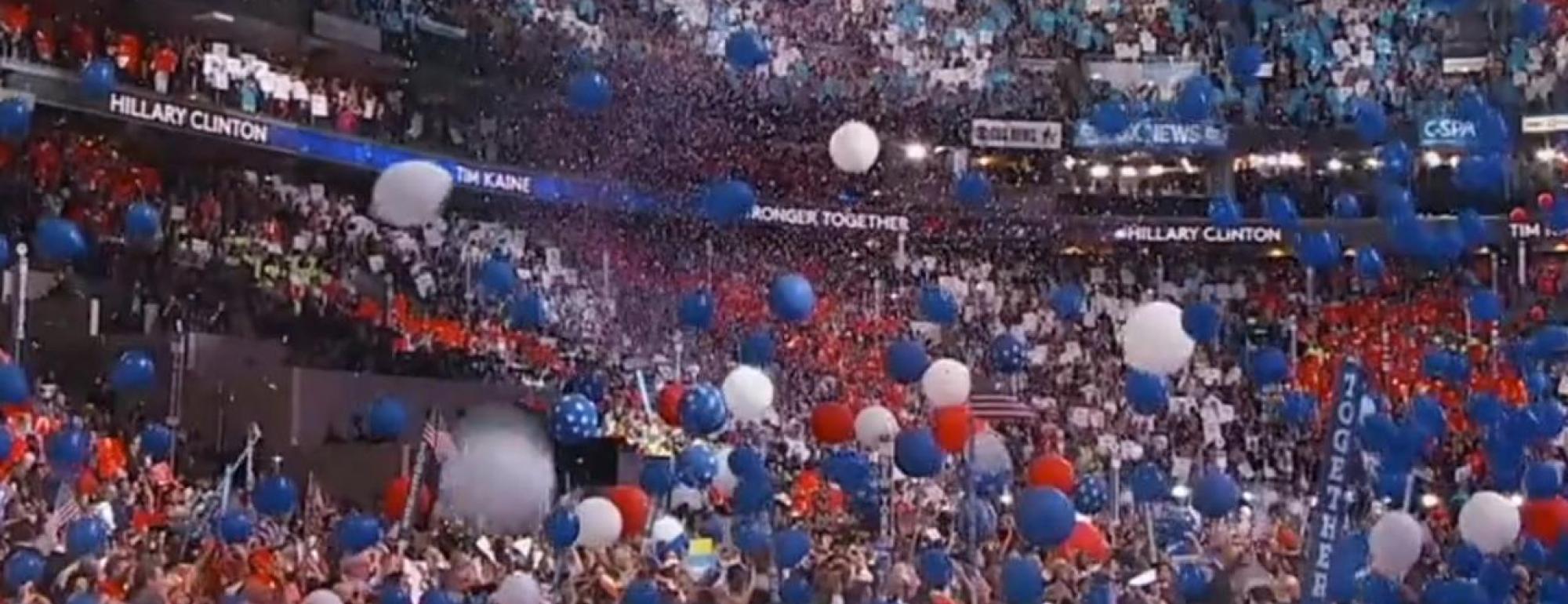 balloons drop from the ceiling of a democratic convention