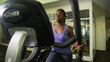 student working out on an exercise machine