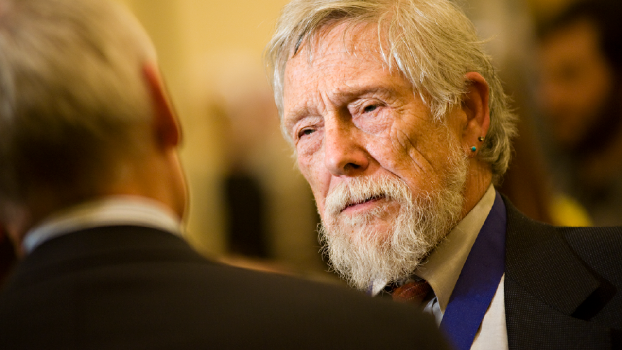 Gary Snyder, with blue ribbon (holding UC Davis medal) around his neck.