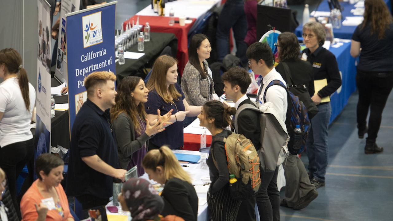 Students give their pitches and find out information during the Spring Career Fair on April 17, 2019.  (Gregory Urquiaga)