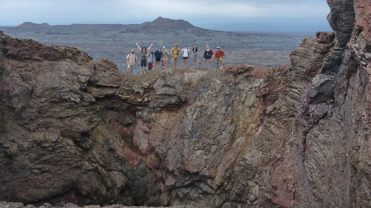 Several UC Davis geology students standing on the rim of a collapsed cone on Kiauwea volcano on Hawaii.