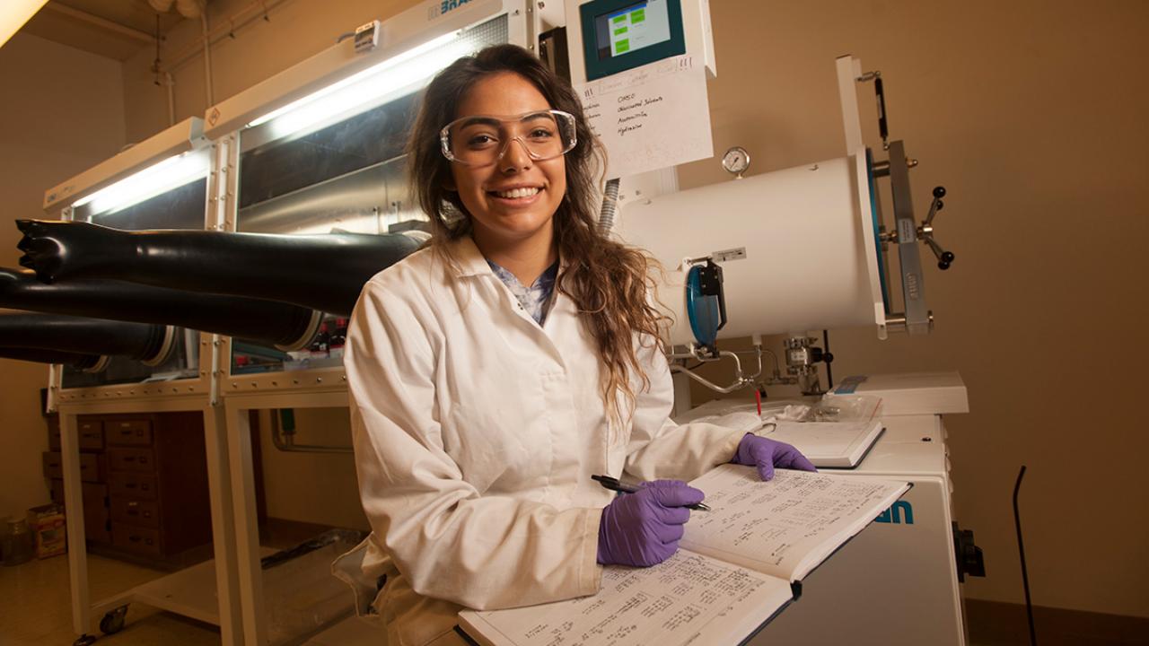 Maia Yellowhorse, a pharmaceutical chemistry major, in Lisa Miller's lab