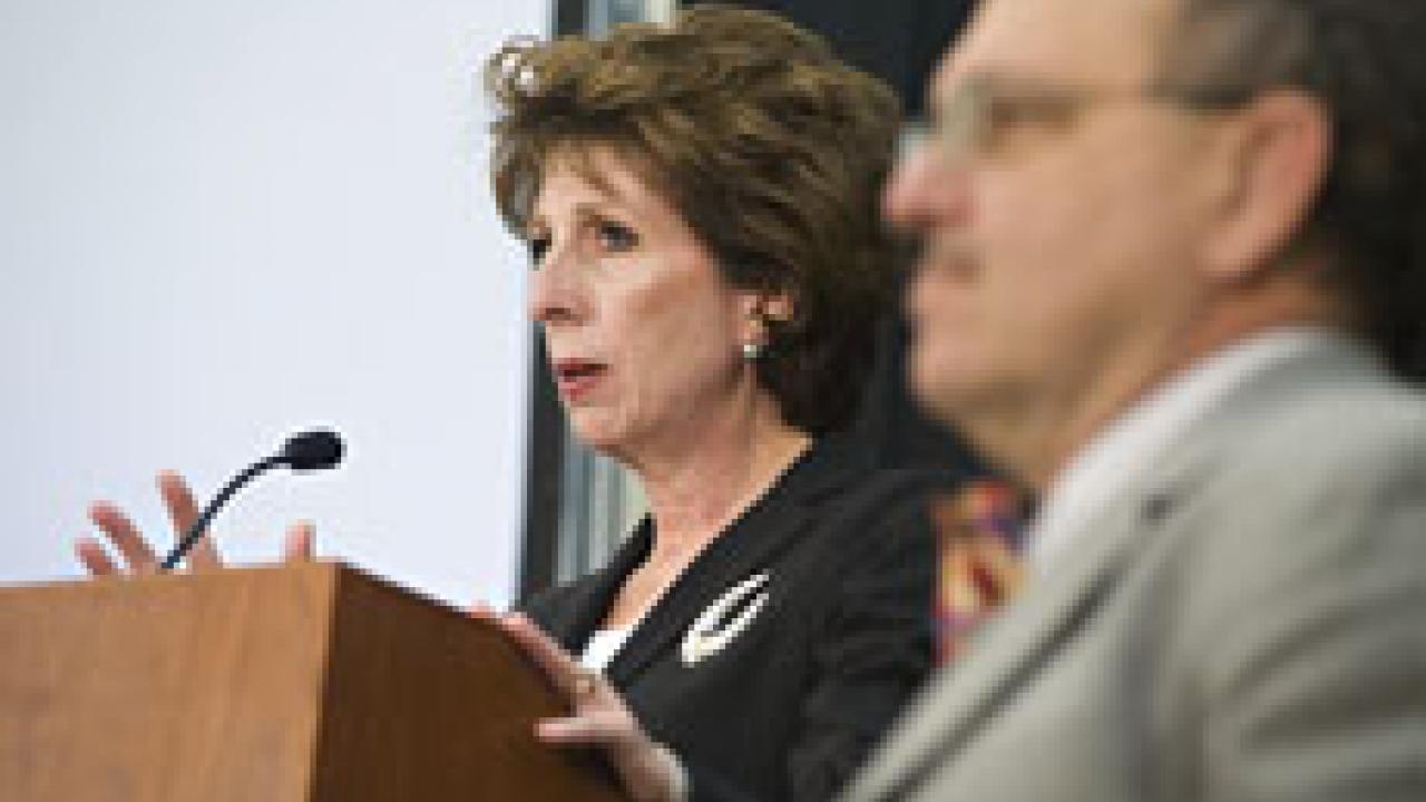 Chancellor Linda Katehi delivers the State of the Campus address on Feb. 11 before the Academic Senate. On the right is senate chair Robert Powell.