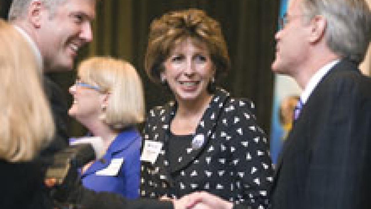 Before giving her keynote speech at the seventh annual Tech Index celebration, Chancellor Linda Katehi talked with Dean Steven Currall of the Graduate School of Management, right, who is shaking hands with GSM alum Vincent Catalano. Marj Dickins