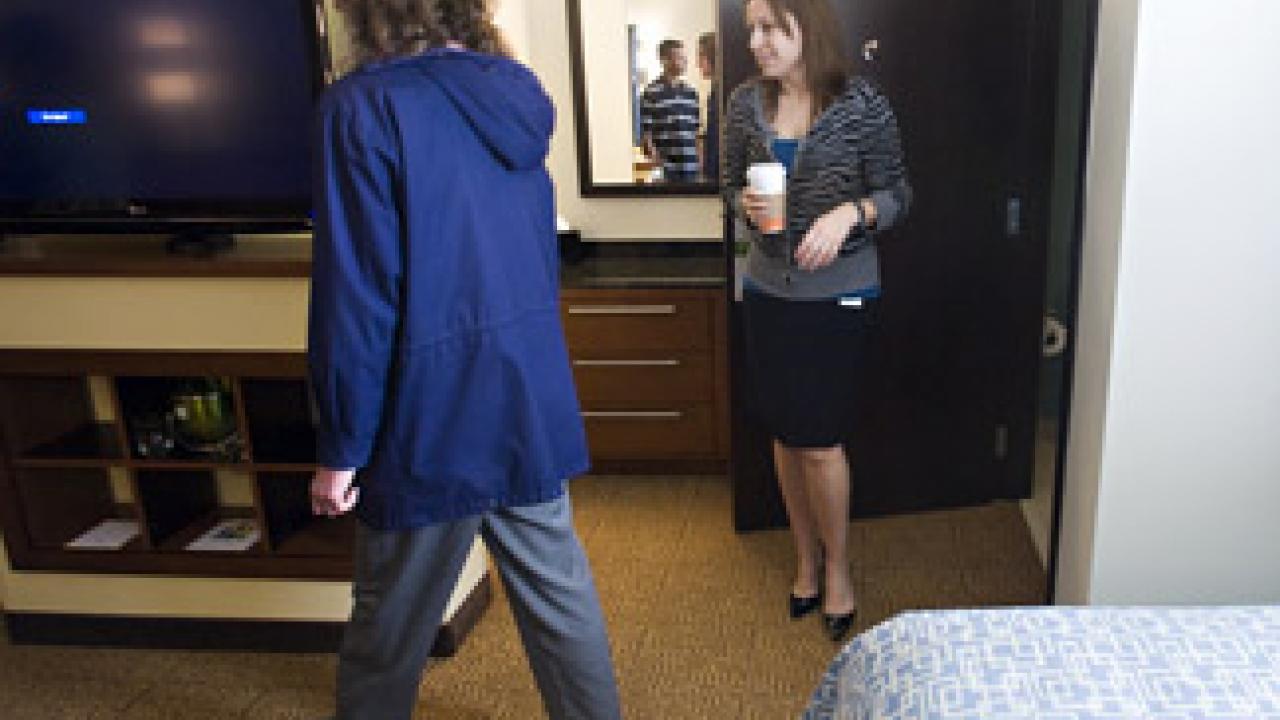 Dawn Mayne and Lupe Sanchez from the nearby Graduate School of Management tour the new Hyatt hotel on campus.
