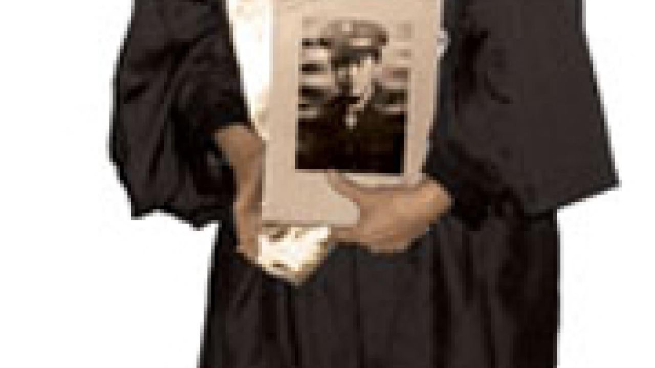 Arlene Ikemoto Lawrence, representing her uncle, Gus Ikemoto, at the December commencement.