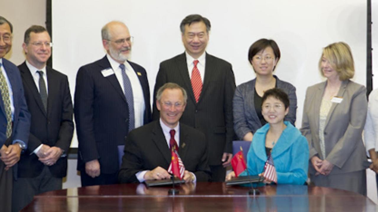 Photo: Signing ceremony, with Ralph J. Hexter, Liu Jinghui and others