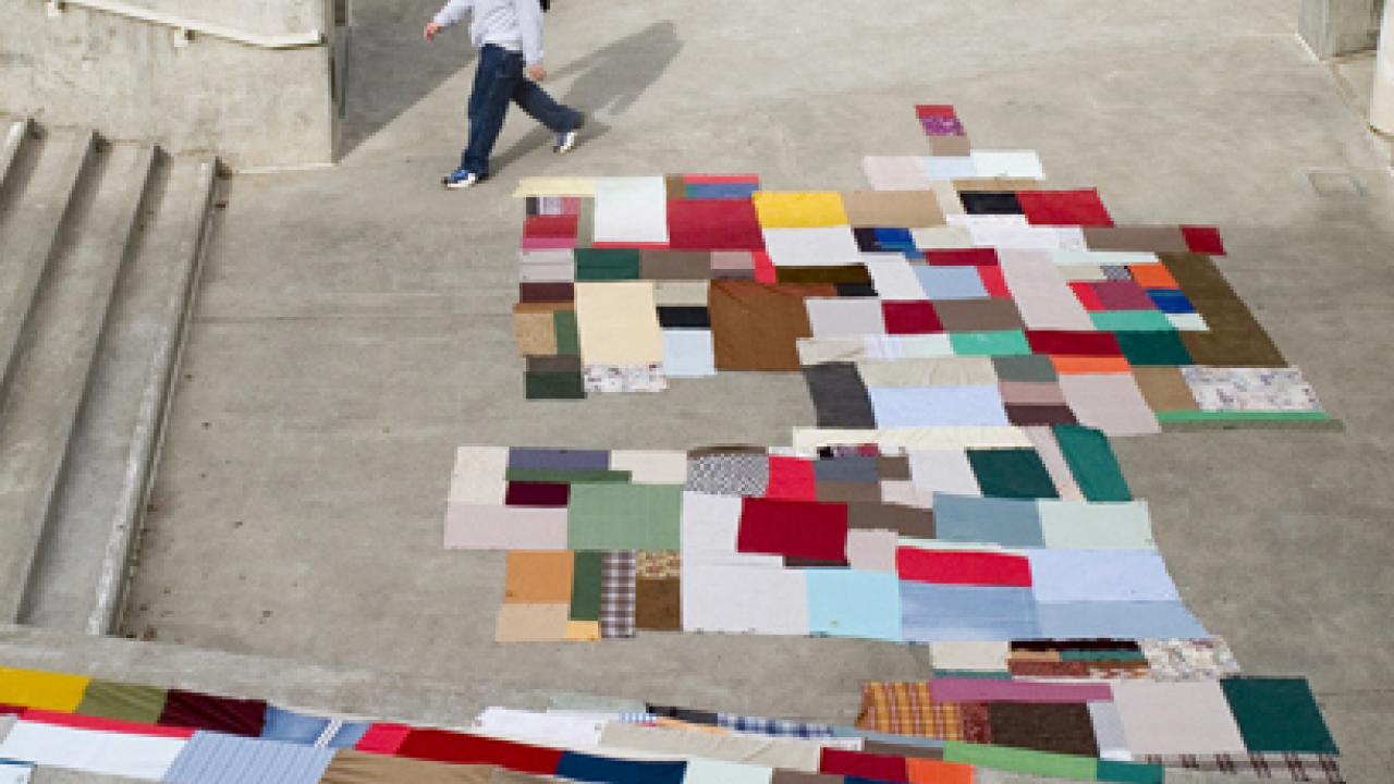 Pieces of cloth in a colorful, quiltlike arrangement comprise Farmscape Death Star in the courtyard of the Humanities and Social Sciences Building.