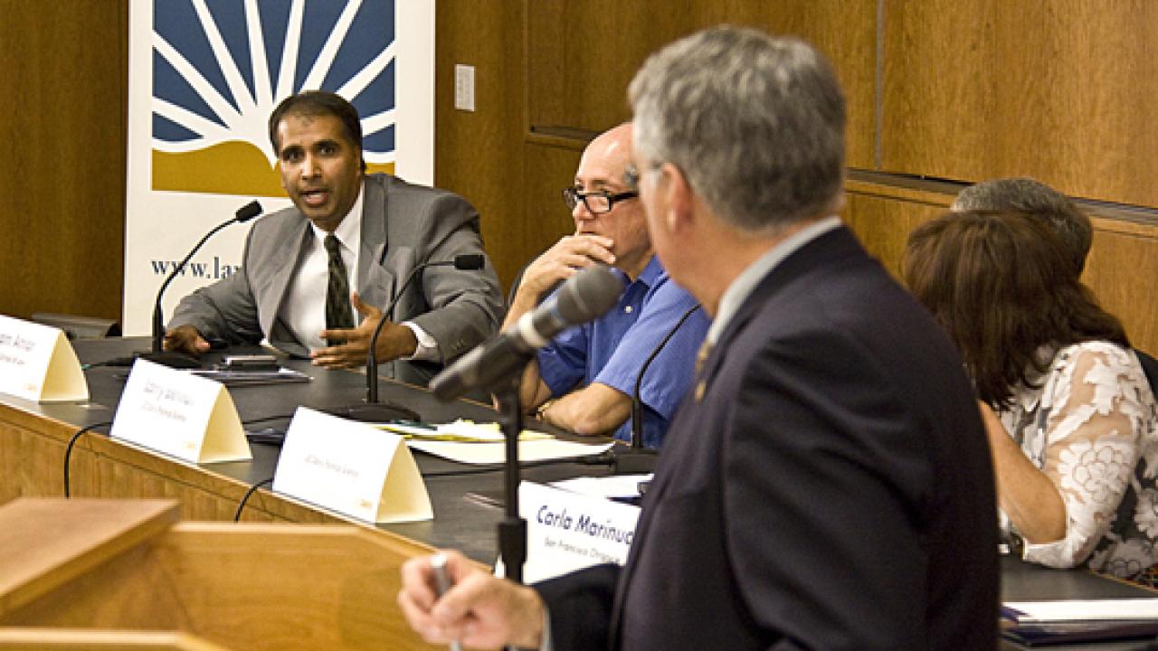 Photo: Panelists for the Debate Watch Forum included professors Vik Amar and Larry Berman, blue shirt, with A.G. Block serving as the moderator.