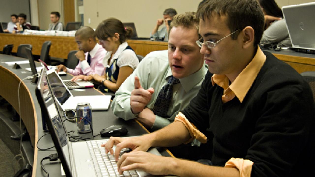 Photo: Daniel Raff, left, and Brian Eller, both third-year law students, carry out fact-checking during the debate, as part of the Truth Team.