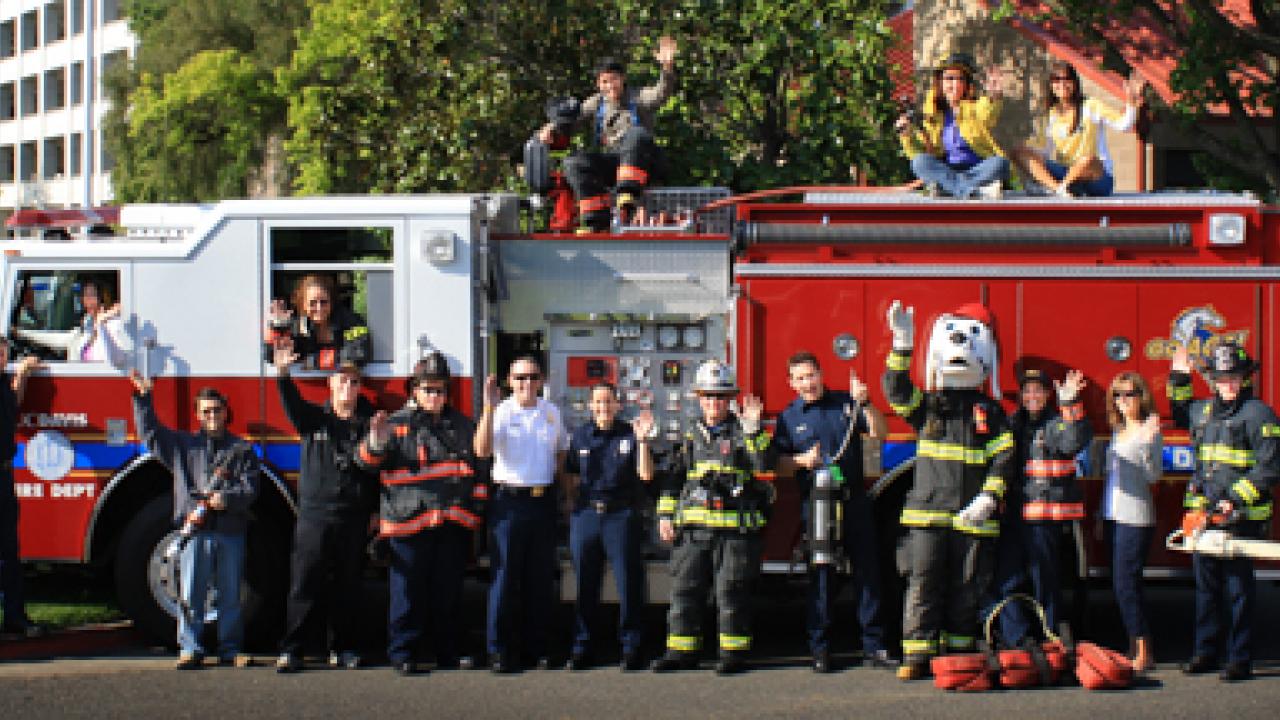 Guess the Weight contest photo: Firetruck, 16 people and Sparky the Fire Dog