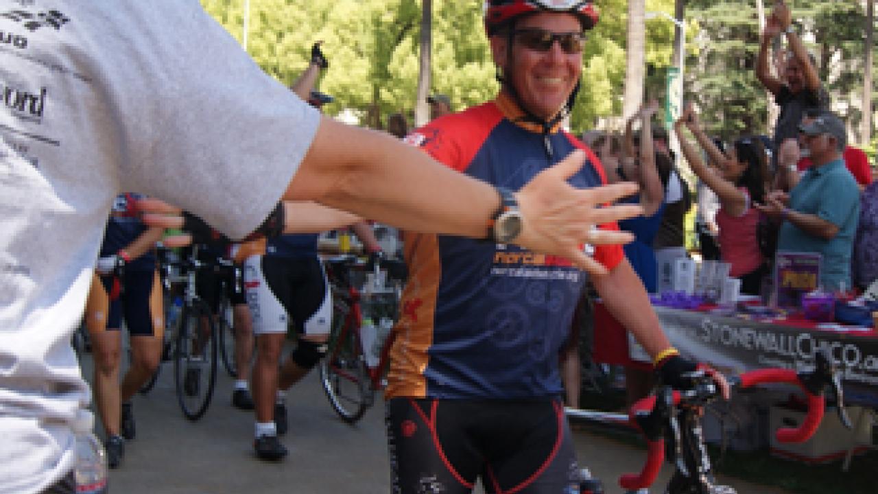 Photo: Capt. Shawn Cullen of the UC Davis Fire Department takes a respite May 20 outside the firehouse, along the route of the NorCal AIDS Cycle.